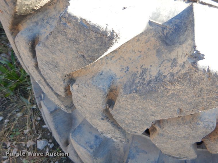 image for item EY9498 (4) 14.00-24 solid tires and wheels