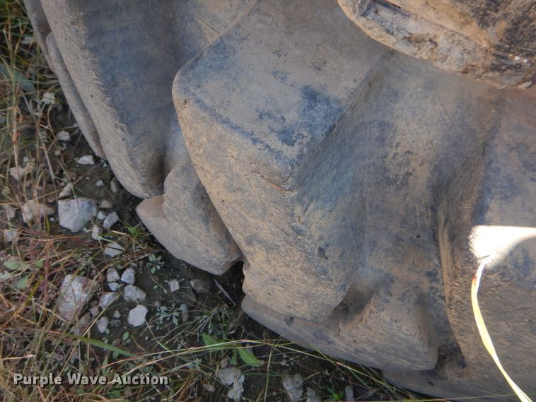 image for item EY9498 (4) 14.00-24 solid tires and wheels