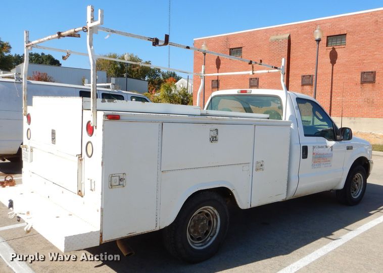 image for item FA9807 2003 Ford F250 Super Duty utility bed pickup truck