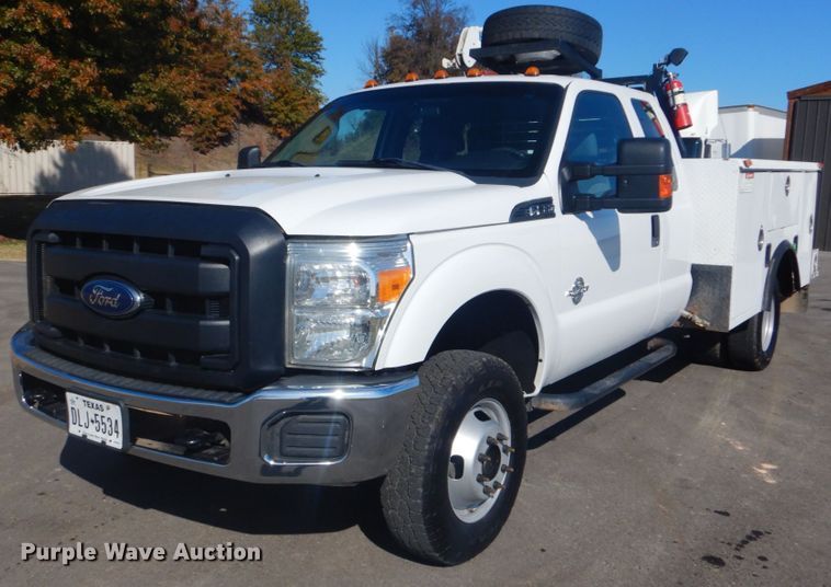 image for item FF9089 2014 Ford F350 Super Duty SuperCab utility bed pickup truck with crane