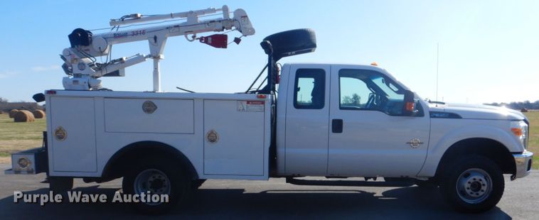 image for item FF9089 2014 Ford F350 Super Duty SuperCab utility bed pickup truck with crane