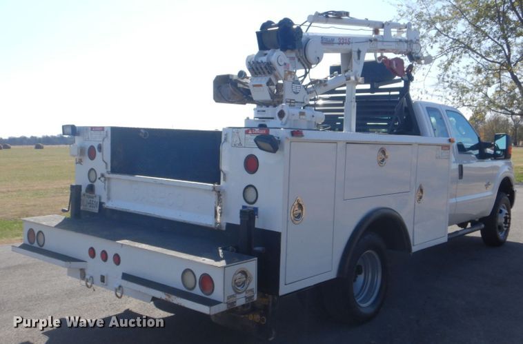 image for item FF9089 2014 Ford F350 Super Duty SuperCab utility bed pickup truck with crane