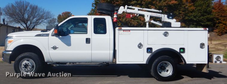 image for item FF9089 2014 Ford F350 Super Duty SuperCab utility bed pickup truck with crane