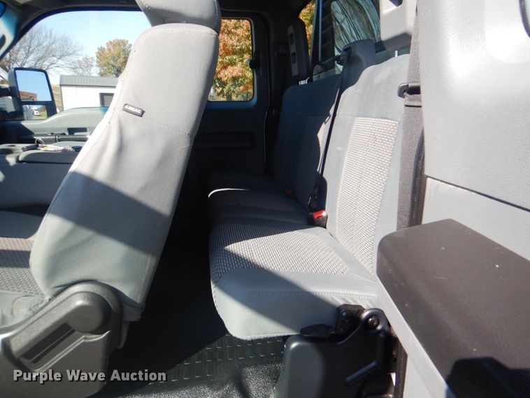 image for item FF9089 2014 Ford F350 Super Duty SuperCab utility bed pickup truck with crane