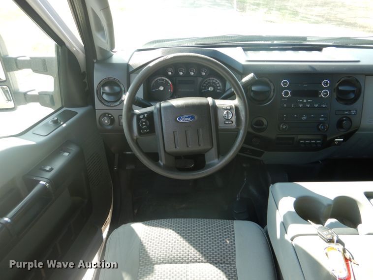 image for item FF9089 2014 Ford F350 Super Duty SuperCab utility bed pickup truck with crane