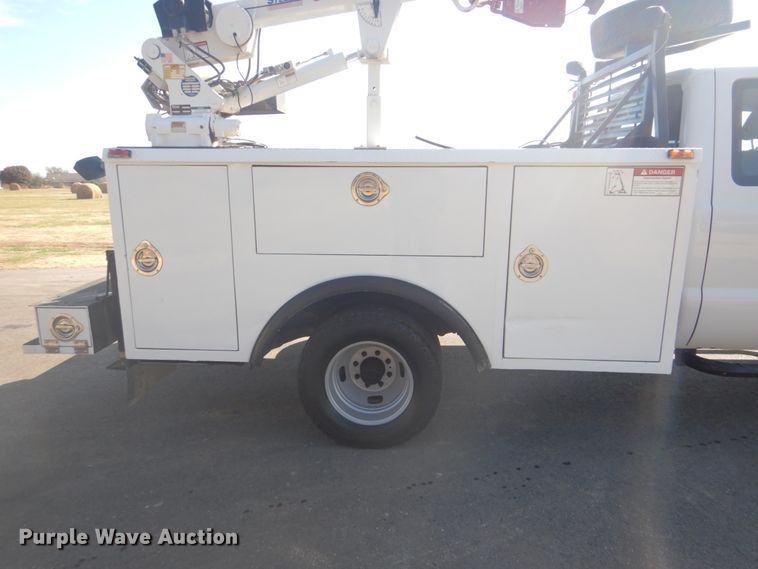 image for item FF9089 2014 Ford F350 Super Duty SuperCab utility bed pickup truck with crane