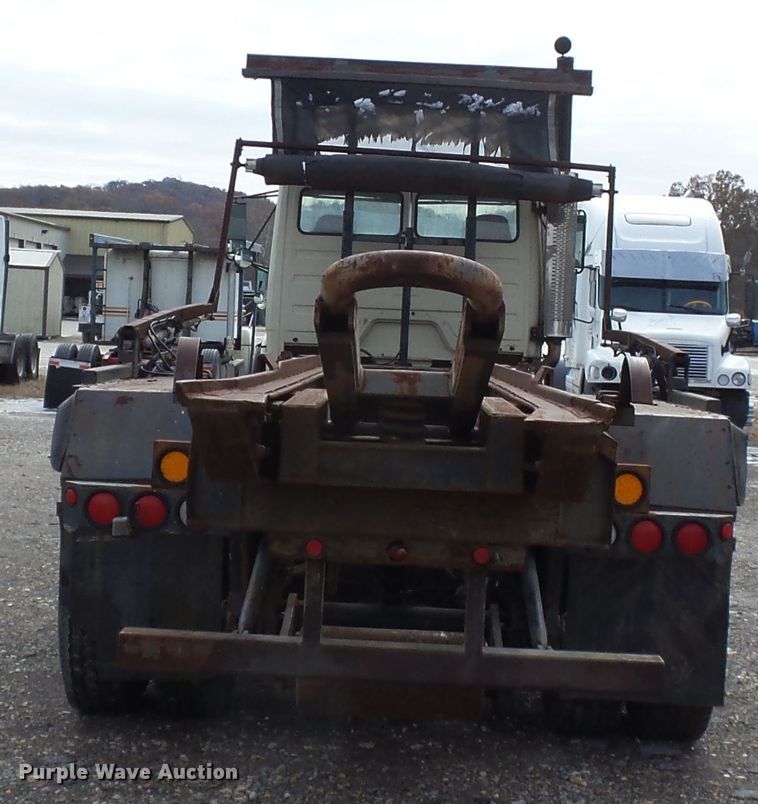 image for item DH7765 2003 Freightliner FL106 roll-off container truck