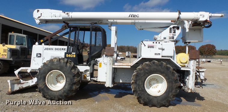 image for item DH7782 1997 John Deere 540B skidder with aerial bucket lift