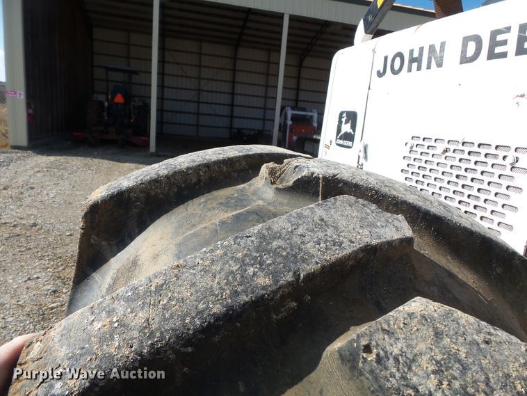 image for item DH7782 1997 John Deere 540B skidder with aerial bucket lift