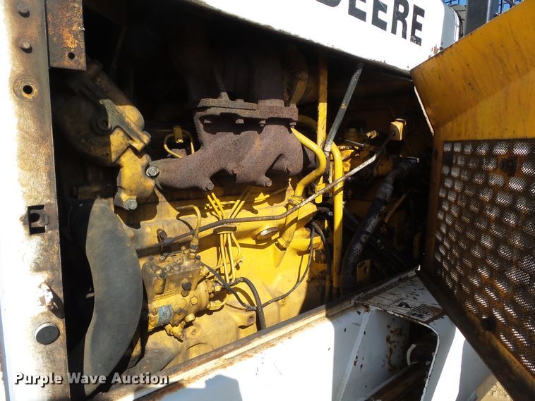 image for item DH7782 1997 John Deere 540B skidder with aerial bucket lift