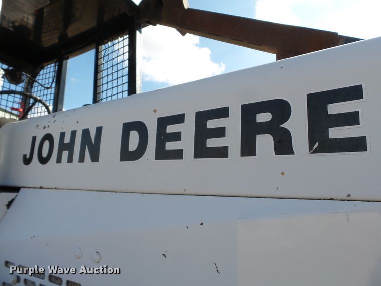 image for item DH7782 1997 John Deere 540B skidder with aerial bucket lift