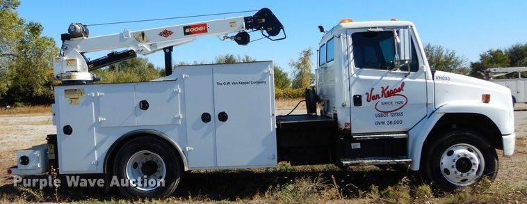 image for item FK9967 2004 Freightliner FL70 utility bed truck with crane