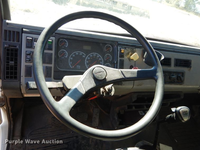 image for item FK9967 2004 Freightliner FL70 utility bed truck with crane