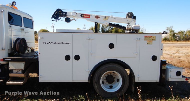 image for item FK9967 2004 Freightliner FL70 utility bed truck with crane