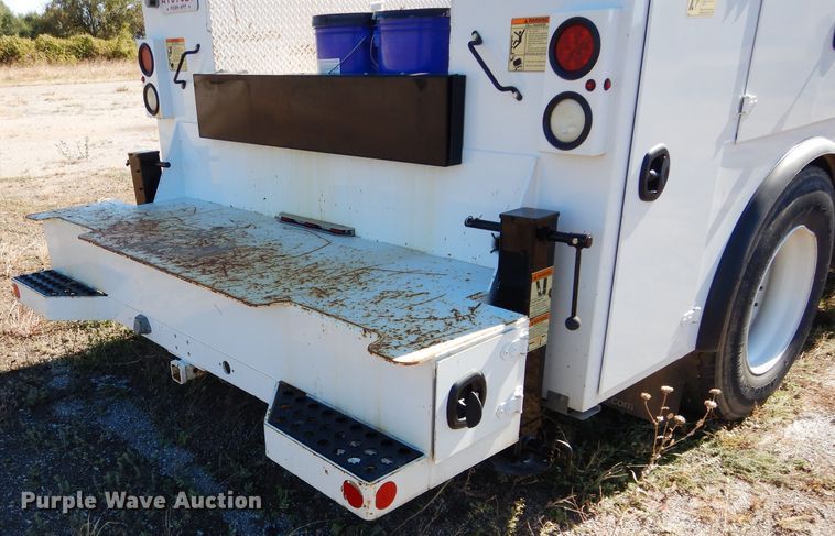 image for item FK9967 2004 Freightliner FL70 utility bed truck with crane