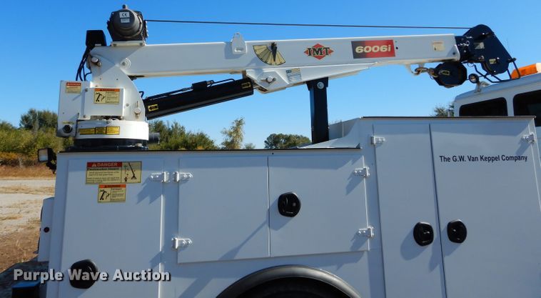 image for item FK9967 2004 Freightliner FL70 utility bed truck with crane