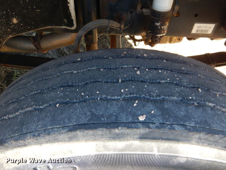 image for item FK9967 2004 Freightliner FL70 utility bed truck with crane