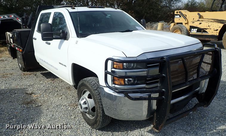 image for item DB7580 2015 Chevrolet Silverado 3500HD Crew Cab flatbed pickup truck