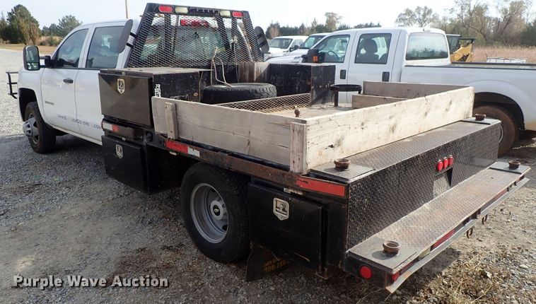 image for item DB7580 2015 Chevrolet Silverado 3500HD Crew Cab flatbed pickup truck