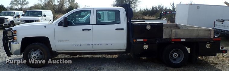 image for item DB7580 2015 Chevrolet Silverado 3500HD Crew Cab flatbed pickup truck