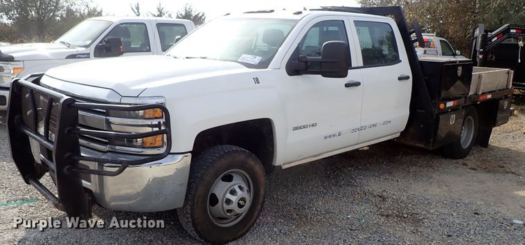 image for item DB7580 2015 Chevrolet Silverado 3500HD Crew Cab flatbed pickup truck