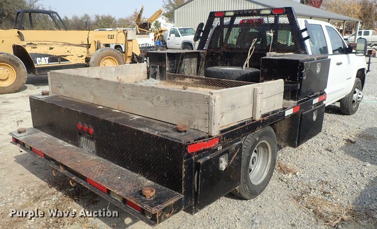 image for item DB7580 2015 Chevrolet Silverado 3500HD Crew Cab flatbed pickup truck