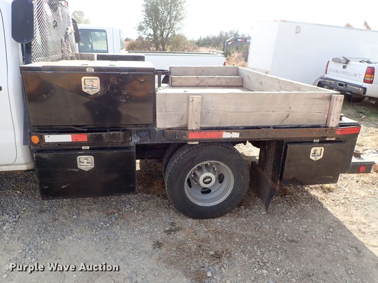 image for item DB7580 2015 Chevrolet Silverado 3500HD Crew Cab flatbed pickup truck