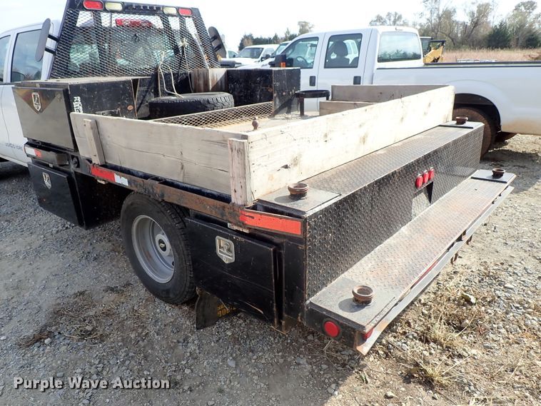 image for item DB7580 2015 Chevrolet Silverado 3500HD Crew Cab flatbed pickup truck