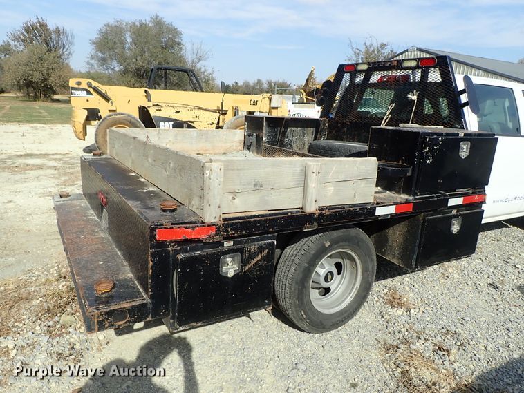 image for item DB7580 2015 Chevrolet Silverado 3500HD Crew Cab flatbed pickup truck