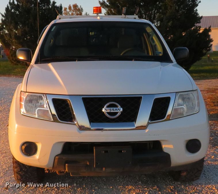 image for item DH1678 2014 Nissan Frontier Ext. Cab flatbed pickup truck