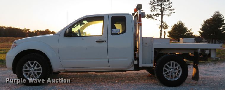 image for item DH1678 2014 Nissan Frontier Ext. Cab flatbed pickup truck