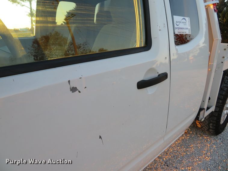 image for item DH1678 2014 Nissan Frontier Ext. Cab flatbed pickup truck