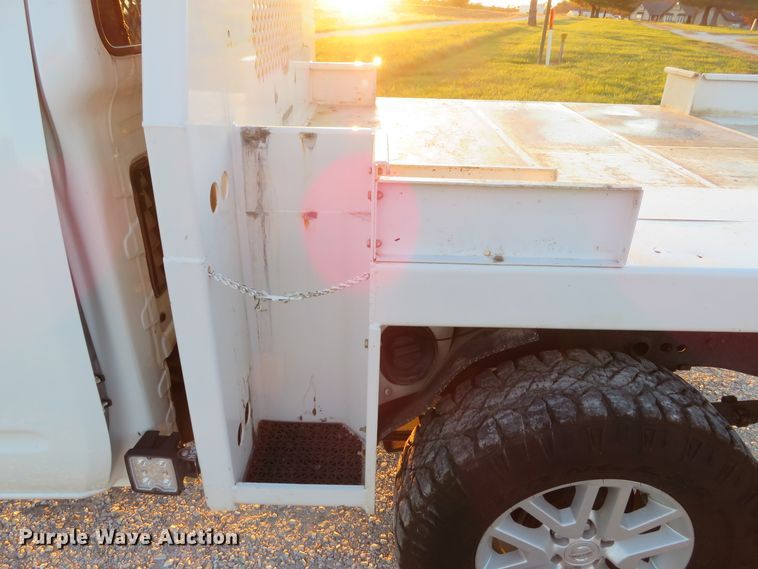 image for item DH1678 2014 Nissan Frontier Ext. Cab flatbed pickup truck