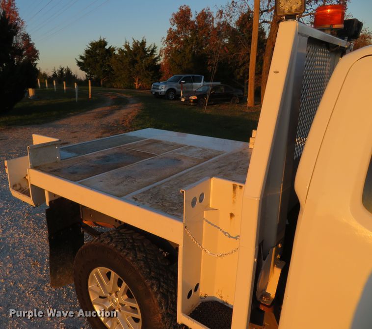 image for item DH1678 2014 Nissan Frontier Ext. Cab flatbed pickup truck