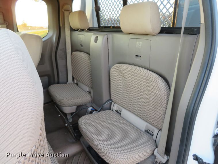 image for item DH1678 2014 Nissan Frontier Ext. Cab flatbed pickup truck