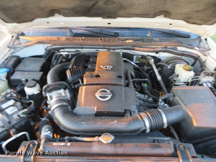 image for item DH1678 2014 Nissan Frontier Ext. Cab flatbed pickup truck