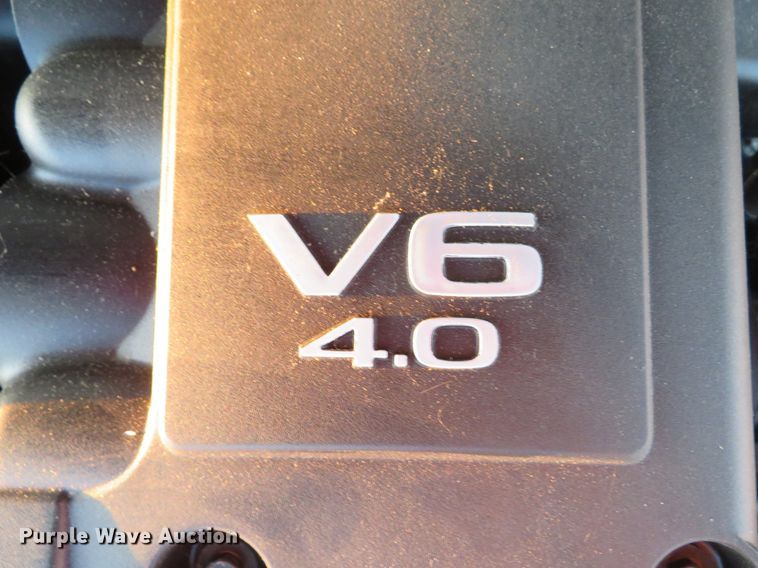 image for item DH1678 2014 Nissan Frontier Ext. Cab flatbed pickup truck