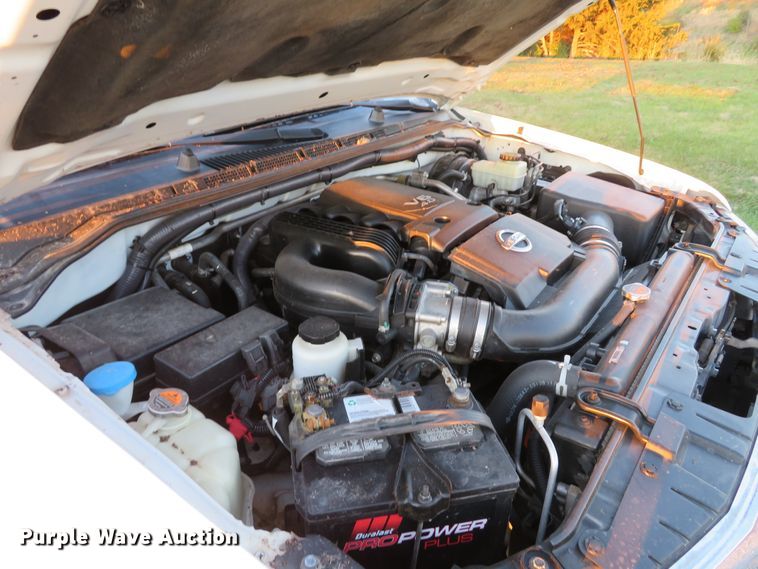 image for item DH1678 2014 Nissan Frontier Ext. Cab flatbed pickup truck