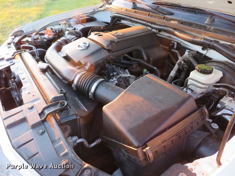 image for item DH1678 2014 Nissan Frontier Ext. Cab flatbed pickup truck