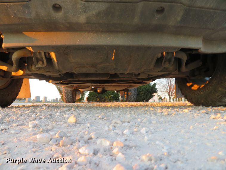 image for item DH1678 2014 Nissan Frontier Ext. Cab flatbed pickup truck