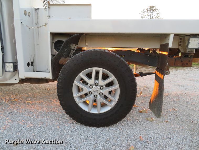 image for item DH1678 2014 Nissan Frontier Ext. Cab flatbed pickup truck