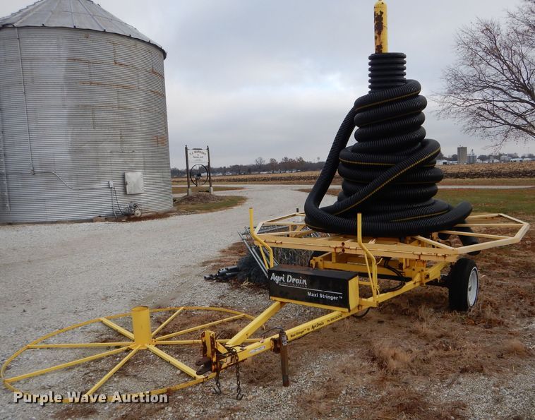 image for item FI9747 2003 Agri Drain Maxi Stringer reel trailer