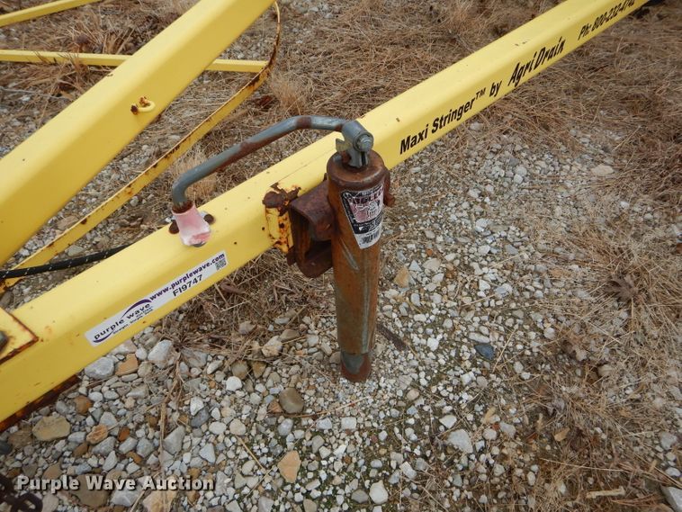 image for item FI9747 2003 Agri Drain Maxi Stringer reel trailer