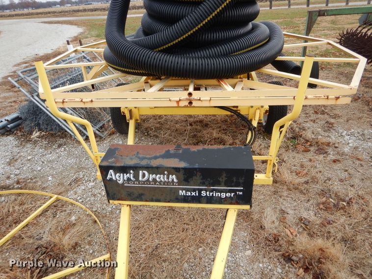 image for item FI9747 2003 Agri Drain Maxi Stringer reel trailer