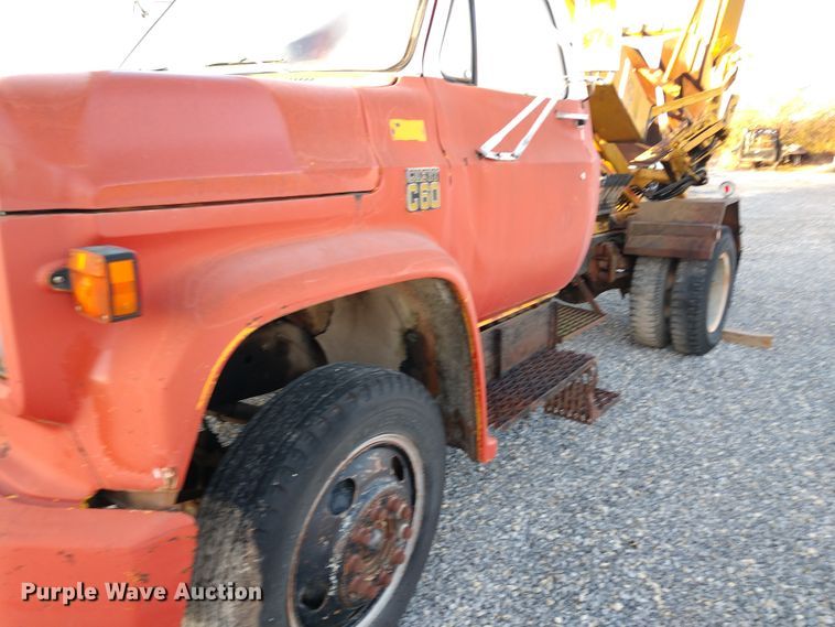 image for item DE6867 1977 Chevrolet C60 truck with Vermeer tree spade
