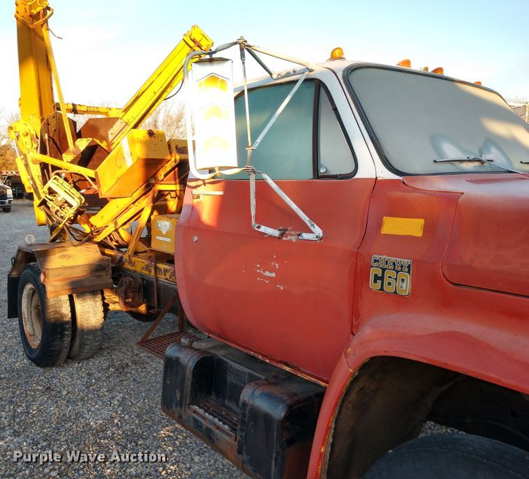 image for item DE6867 1977 Chevrolet C60 truck with Vermeer tree spade