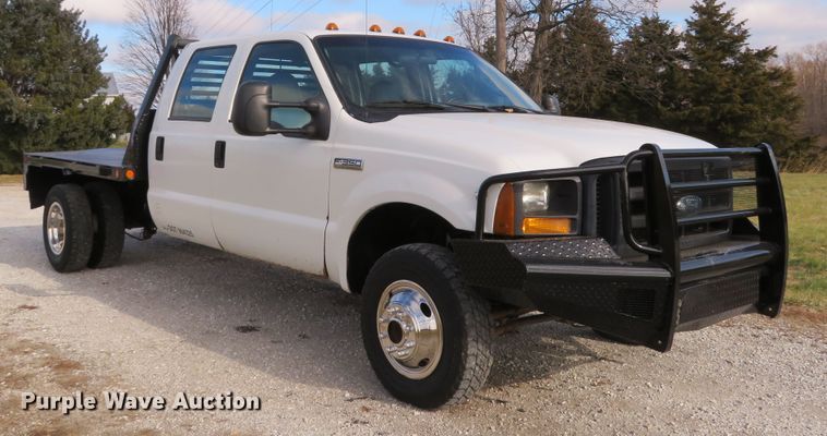image for item DH1703 2006 Ford F350 Super Duty XL Crew Cab flatbed pickup truck