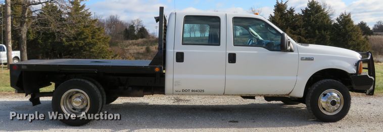 image for item DH1703 2006 Ford F350 Super Duty XL Crew Cab flatbed pickup truck