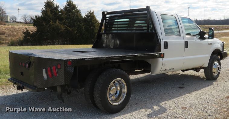 image for item DH1703 2006 Ford F350 Super Duty XL Crew Cab flatbed pickup truck