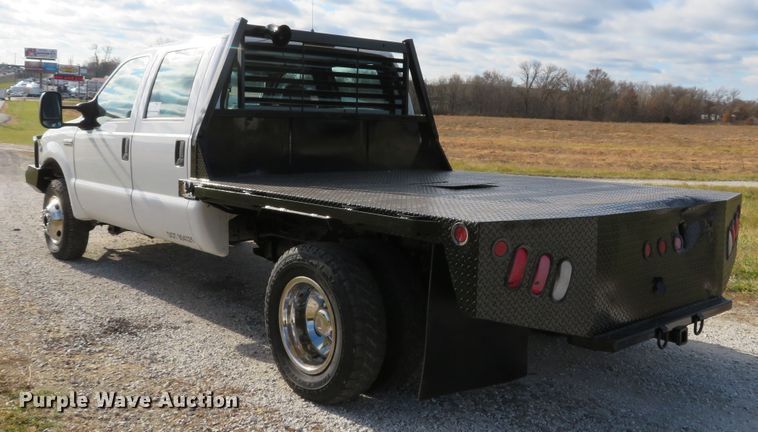 image for item DH1703 2006 Ford F350 Super Duty XL Crew Cab flatbed pickup truck